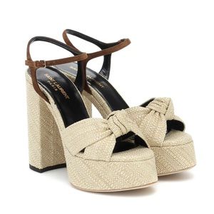 Like new worn once Bianca raffia platform sandals.